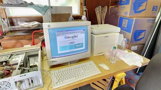 A computer showing the original Google homepage design sits in the garage where Google got its start.